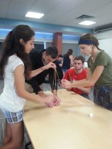 Students creating towers out of spaghetti