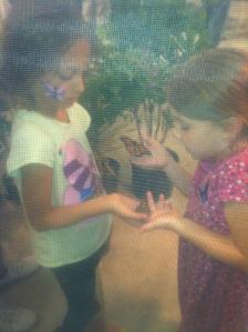 Tanya and her friend Madeline in a butterfly tent
